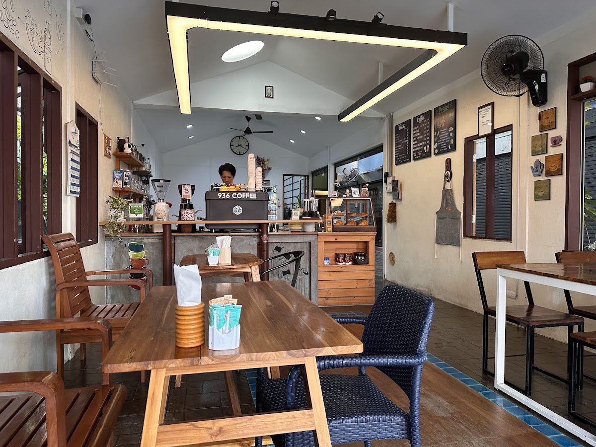 Interior of 936 Coffee with barista at the counter